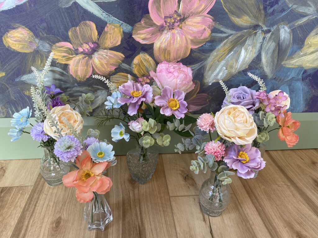 Bud vases using pastel colours