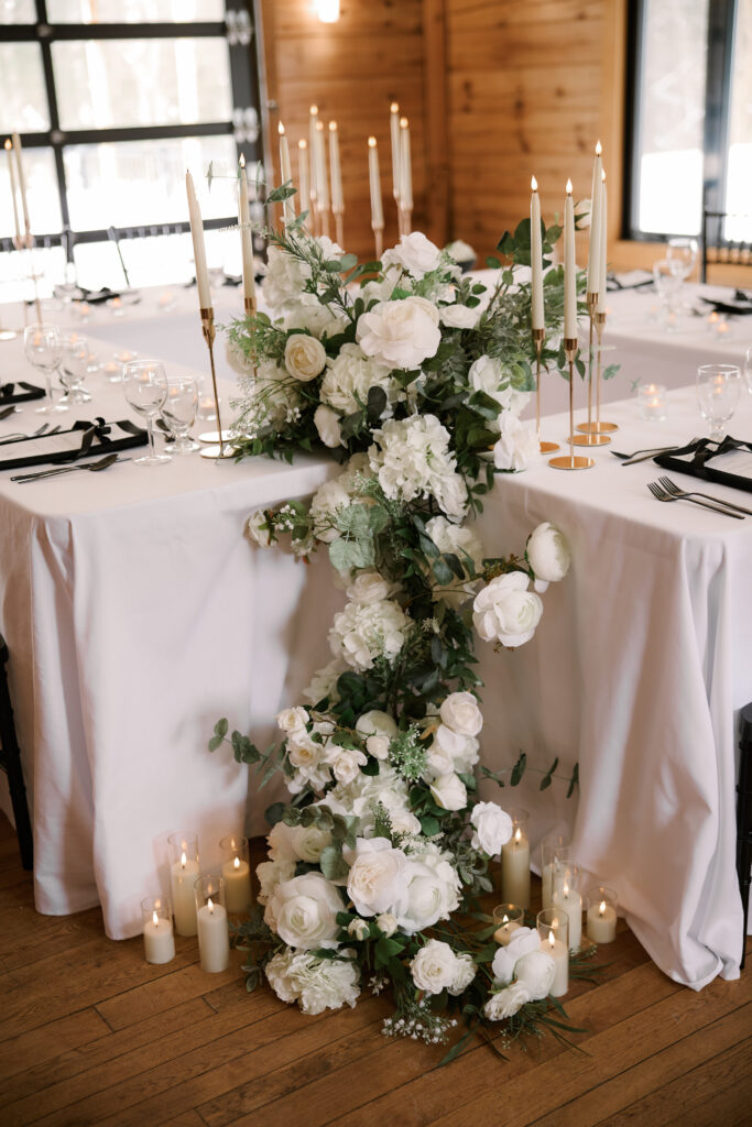 Cascading floral arrangement using white faux florals